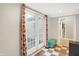 Sunroom featuring double doors, checkerboard floors and storage bench at 3933 Byram Ave, Indianapolis, IN 46208