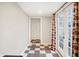 Sunroom featuring double doors, checkered floors, and easy access to outdoors at 3933 Byram Ave, Indianapolis, IN 46208