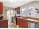 Functional kitchen featuring stainless steel appliances and tiled floors at 3933 Byram Ave, Indianapolis, IN 46208