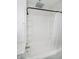 Stylish white bathtub and tile shower with updated fixtures at 602 N Harrison St, Alexandria, IN 46001