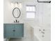 Renovated bathroom with marble walls and floor, vanity, and a new shower at 602 N Harrison St, Alexandria, IN 46001