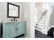 Bathroom with a lovely sink vanity and view of the home's staircase at 602 N Harrison St, Alexandria, IN 46001