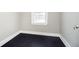 Empty bedroom featuring dark hardwood floors, white trim and one window at 602 N Harrison St, Alexandria, IN 46001