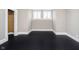 Empty bedroom featuring dark hardwood floors, white trim, and two windows at 602 N Harrison St, Alexandria, IN 46001