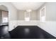 The dining room features wainscoting, dark wood floors, and contemporary lighting at 602 N Harrison St, Alexandria, IN 46001