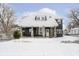 Charming home exterior featuring stone pillar accents on a snow-covered lot at 602 N Harrison St, Alexandria, IN 46001