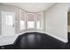 Open-plan living area offers bright bay windows, light-colored walls, and access to front door at 602 N Harrison St, Alexandria, IN 46001