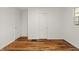Bedroom with refinished hardwood floors and ample natural light at 633 S Grand Ave, Indianapolis, IN 46219