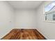 Bedroom with refinished hardwood floors and ample natural light at 633 S Grand Ave, Indianapolis, IN 46219