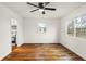 Bright bedroom featuring hardwood floors, fresh white walls, and a modern ceiling fan with light at 633 S Grand Ave, Indianapolis, IN 46219
