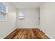 Bedroom with refinished hardwood floors and ample natural light at 633 S Grand Ave, Indianapolis, IN 46219
