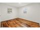 Bedroom with refinished hardwood floors and ample natural light at 633 S Grand Ave, Indianapolis, IN 46219