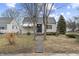 Charming single-story home with a stone walkway leading to the front door and a well-maintained lawn at 633 S Grand Ave, Indianapolis, IN 46219