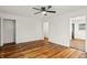 Bright living room featuring hardwood floors, fresh white walls, and neutral tones at 633 S Grand Ave, Indianapolis, IN 46219