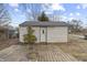 View of a shed from the backyard with a small wood deck and sparse landscaping at 633 S Grand Ave, Indianapolis, IN 46219