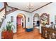 Spacious foyer features hardwood floors, archways, and classic architectural details at 66 N Ritter Ave, Indianapolis, IN 46219