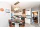 Charming kitchen with island, white cabinets, updated appliances, and view to the living area at 66 N Ritter Ave, Indianapolis, IN 46219
