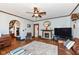 Cozy living room features a fireplace, hardwood floors, and classic trim at 66 N Ritter Ave, Indianapolis, IN 46219