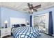 Inviting main bedroom with sliding glass doors to a deck, and bright natural light at 66 N Ritter Ave, Indianapolis, IN 46219