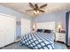A spacious main bedroom features two closets, neutral colors, and ceiling fan at 66 N Ritter Ave, Indianapolis, IN 46219