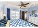 Comfortable bedroom with balcony access and a well-lit interior at 66 N Ritter Ave, Indianapolis, IN 46219