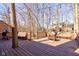 Wooden deck with built-in seating and benches surrounding a fire pit for relaxing and entertaining at 8349 Tequista Cir, Indianapolis, IN 46236