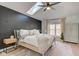Cozy bedroom boasts a skylight, black accent wall, soft bedding, and stylish furnishings, creating a relaxing atmosphere at 8349 Tequista Cir, Indianapolis, IN 46236