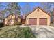 Charming brick home with an attached two-car garage and well-maintained landscaping at 8349 Tequista Cir, Indianapolis, IN 46236