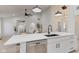 Bright open concept kitchen, white cabinets, and island seating at 8349 Tequista Cir, Indianapolis, IN 46236