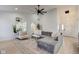 Modern living room featuring stylish furnishings, large mirror and bright open space at 8349 Tequista Cir, Indianapolis, IN 46236