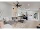 Bright living room with modern decor, high ceilings, and open concept to kitchen at 8349 Tequista Cir, Indianapolis, IN 46236