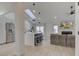 Open concept living room with modern kitchen, sleek island, and lots of natural light at 8349 Tequista Cir, Indianapolis, IN 46236