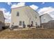 View of the backyard with a gravel area with outdoor seating, grill, and a grassy area at 9703 W Stargazer Dr, Pendleton, IN 46064