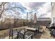 View of the backyard with a gravel area with outdoor seating, grill, and a grassy area at 9703 W Stargazer Dr, Pendleton, IN 46064