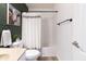 The bathroom includes a toilet, framed art, and a bathtub with shower at 9703 W Stargazer Dr, Pendleton, IN 46064
