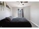 This bedroom offers cozy carpet, soft neutral walls, and a ceiling fan with light fixture at 9703 W Stargazer Dr, Pendleton, IN 46064