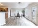 Bright dining area featuring wood-look flooring and a sliding glass door at 9703 W Stargazer Dr, Pendleton, IN 46064