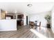 Bright dining area features wood-look flooring and a view of the kitchen at 9703 W Stargazer Dr, Pendleton, IN 46064