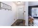 Inviting entryway with a lovely rug, message board, and front door at 9703 W Stargazer Dr, Pendleton, IN 46064