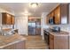 Well-equipped kitchen with stainless steel appliances, wood cabinets, and ample counter space at 9703 W Stargazer Dr, Pendleton, IN 46064