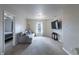Comfortable living room with a large sofa, mounted television, and cozy lighting at 9703 W Stargazer Dr, Pendleton, IN 46064