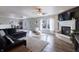 Spacious living room with a fireplace, ceiling fan, and plenty of natural light at 9703 W Stargazer Dr, Pendleton, IN 46064