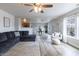 Bright open-concept living area with dining space, a large sofa, and bar seating at 9703 W Stargazer Dr, Pendleton, IN 46064