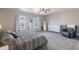 Spacious main bedroom with two windows, neutral colors, and cozy furniture at 9703 W Stargazer Dr, Pendleton, IN 46064