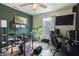 Stylish music room with a drum kit, desk, and plant for creative inspiration at 9703 W Stargazer Dr, Pendleton, IN 46064