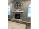 Stunning fireplace with painted brick, a decorative clock, and a white mantel, creating a cozy atmosphere at 971 Alexander St, Greenwood, IN 46143