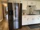 The kitchen offers stainless steel Samsung appliances and white cabinets at 971 Alexander St, Greenwood, IN 46143