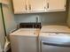 Bright laundry room with a modern dryer and older washing machine at 971 Alexander St, Greenwood, IN 46143