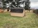 An outbuilding for storage or hobbies, surrounded by a tree-lined lawn and playground at 971 Alexander St, Greenwood, IN 46143