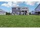 Expansive backyard featuring a two-story deck and lush green lawn perfect for outdoor entertaining and recreation at 1006 Cherry Tree Ln, Greenwood, IN 46143